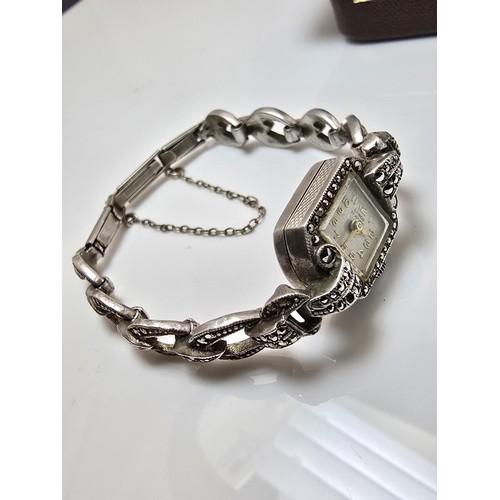 221 - A good quality vintage 1960's sterling silver ladies watch with an ornate design inset with marcasit... 