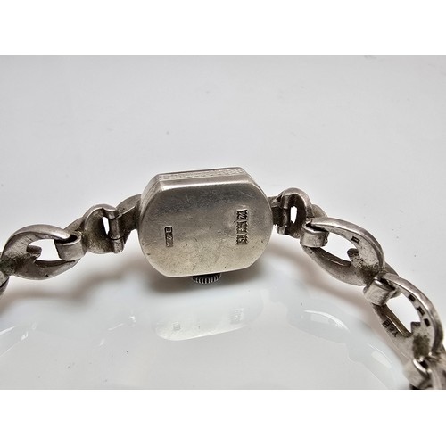 221 - A good quality vintage 1960's sterling silver ladies watch with an ornate design inset with marcasit... 