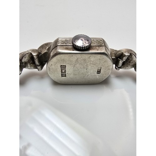 221 - A good quality vintage 1960's sterling silver ladies watch with an ornate design inset with marcasit... 