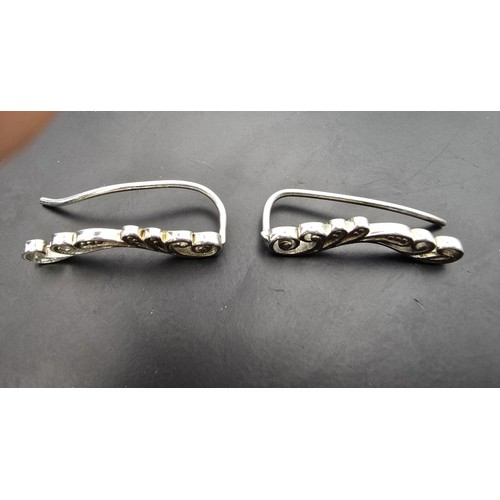 179 - A pair of ornate 925 silver drop earrings in a pierced chase design, in excellent clean condition an... 