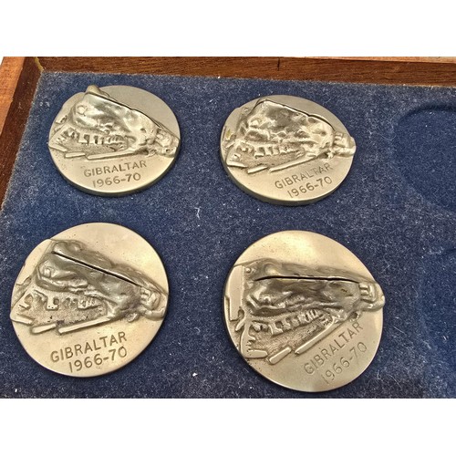 161 - A rare wooden cased set of 4 metal place card holders 
featuring the rock of Gibraltar dated 1966-70... 