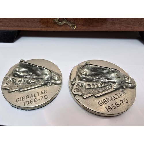 161 - A rare wooden cased set of 4 metal place card holders 
featuring the rock of Gibraltar dated 1966-70... 