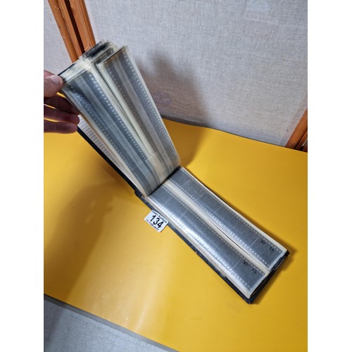 134 - Vintage negatives photo slide album containing 99 negatives covering various subjects including boat... 