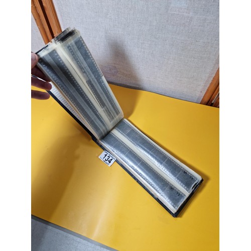 134 - Vintage negatives photo slide album containing 99 negatives covering various subjects including boat... 