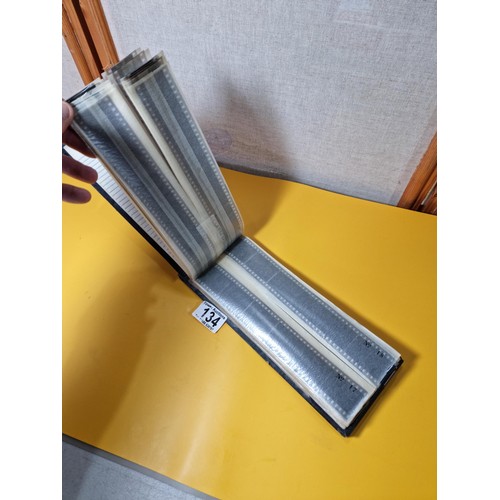 134 - Vintage negatives photo slide album containing 99 negatives covering various subjects including boat... 