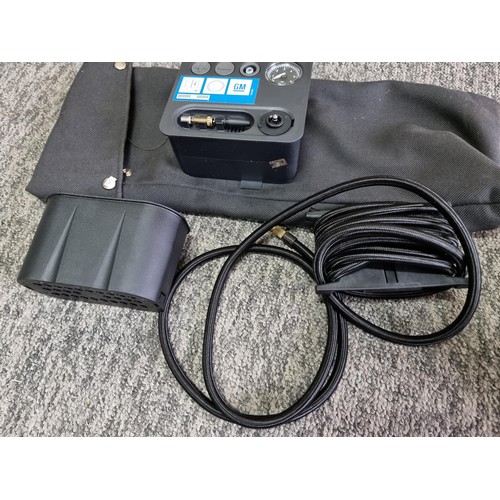 444 - Good GM portable 12v air compressor for inflating car tires complete set. 2 additional canisters of ... 