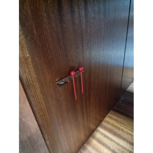 453 - A good quality reproduction drinks cabinate, featuring double flamed mahogany doors revealing a divi... 