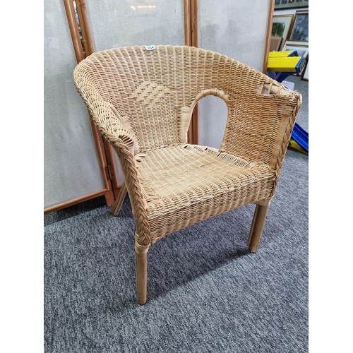 454 - A wicker armed chair in good overall condition, I deal for a bedroom or conservatory,