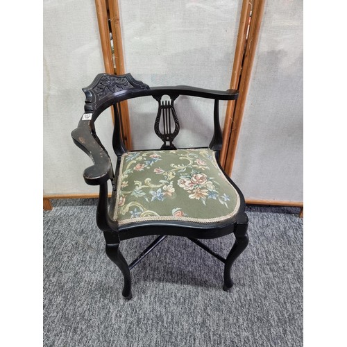 455 - An Edwardian corner chair, Ebonised wood, with a floral padded seat, lovely calving to the back, In ... 