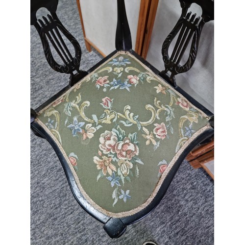 455 - An Edwardian corner chair, Ebonised wood, with a floral padded seat, lovely calving to the back, In ... 
