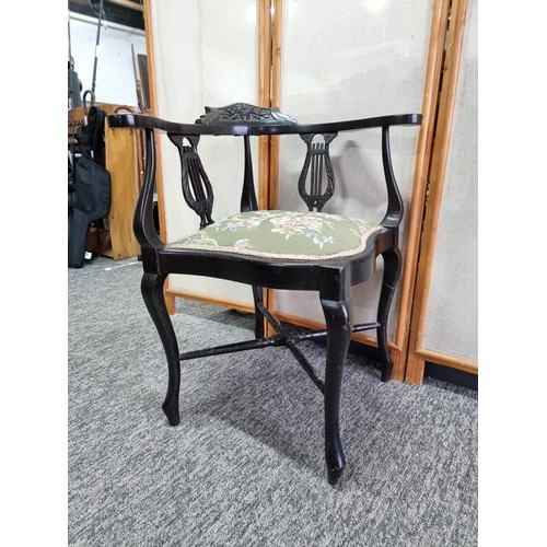 455 - An Edwardian corner chair, Ebonised wood, with a floral padded seat, lovely calving to the back, In ... 