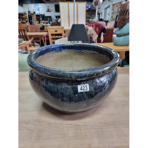 423 - Large mottled blue planter in good order with no chips or cracks measures  28cm high 43cm diameter