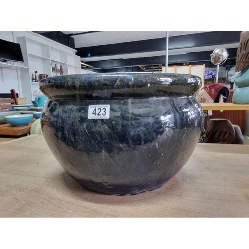 423 - Large mottled blue planter in good order with no chips or cracks measures  28cm high 43cm diameter