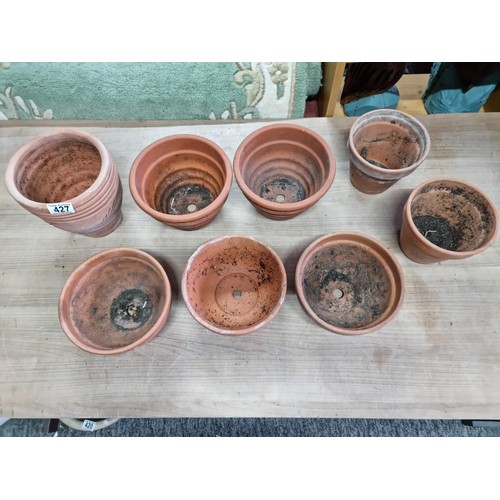 427 - A collection of 8x various terracotta planters to include matching pairs many are stamped made in It... 