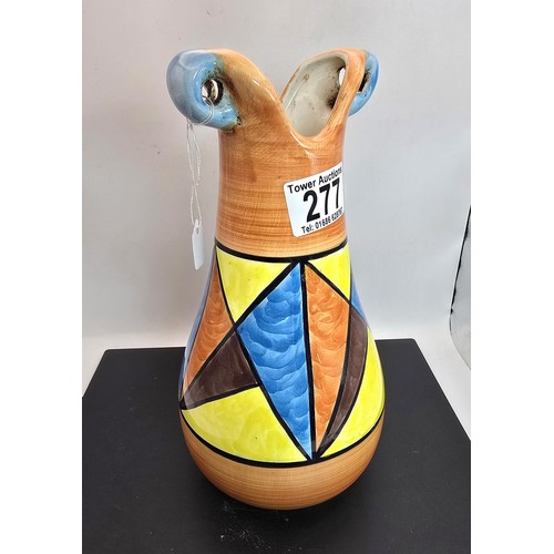 277 - An attractive vintage vase having a vibrant geometric hand painted design, the vase displays nicely ... 