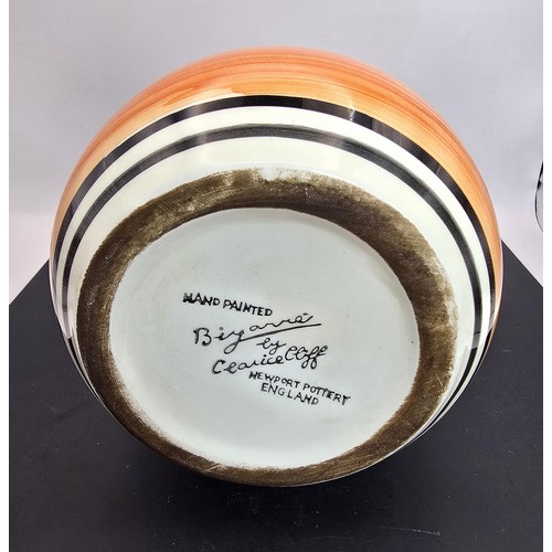 277 - An attractive vintage vase having a vibrant geometric hand painted design, the vase displays nicely ... 