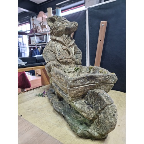 429 - Large Mr Badger (Wind in the Willows) holding a wheelbarrow formed stoneware planter in good looked ... 