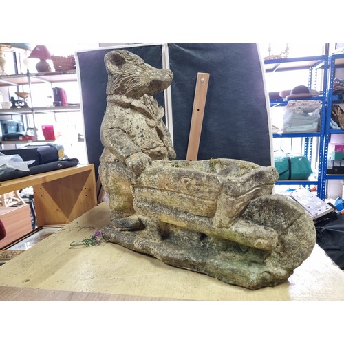 429 - Large Mr Badger (Wind in the Willows) holding a wheelbarrow formed stoneware planter in good looked ... 