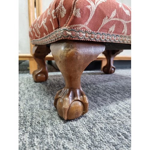 475 - Attractive upholstered foot stool standing on carved wooden claw and ball feet having a clean top an... 