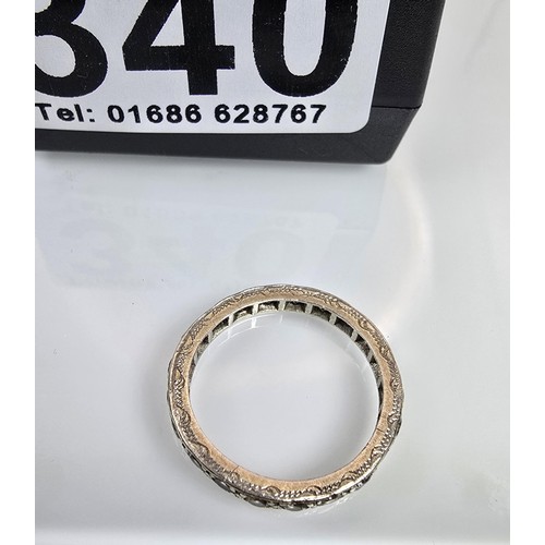 An attractive 9ct white gold eternity ring, has clear spinel gemstones ...