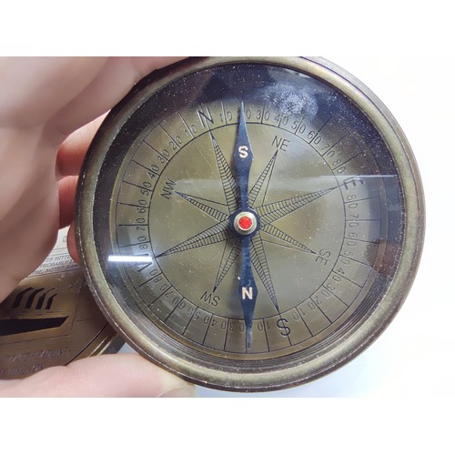 An attractive large brass cased compass commemorating the titanic ...