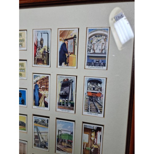 30 - A framed and glazed set of locomotive themed cigarette cards in good condition.