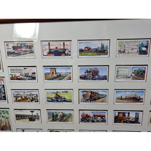 30 - A framed and glazed set of locomotive themed cigarette cards in good condition.