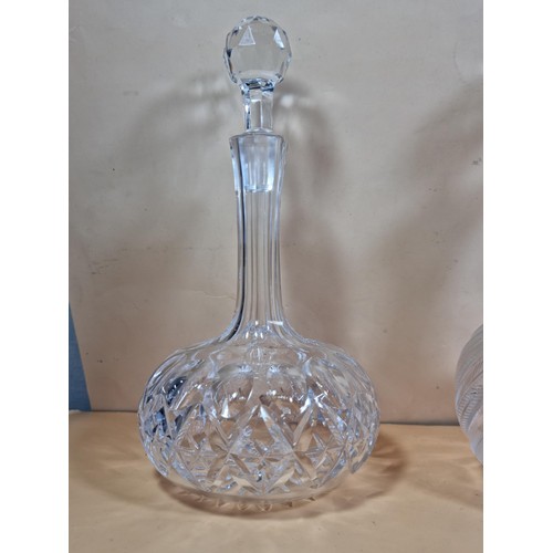 50 - Three good quality cut glass decanters complete with their original glass stoppers. All are in excel... 