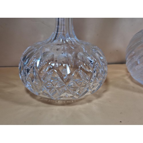 50 - Three good quality cut glass decanters complete with their original glass stoppers. All are in excel... 