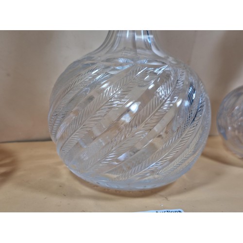 50 - Three good quality cut glass decanters complete with their original glass stoppers. All are in excel... 