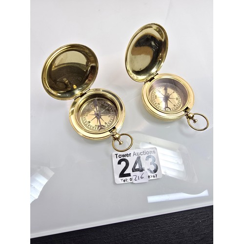 2x attractive brass compasses both having Advertising to the top for ...