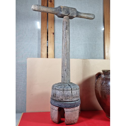 23 - A lidded stoneware brown coloured urn with lid with chips to the top along with a washing clothes do... 