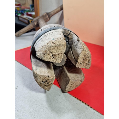 23 - A lidded stoneware brown coloured urn with lid with chips to the top along with a washing clothes do... 