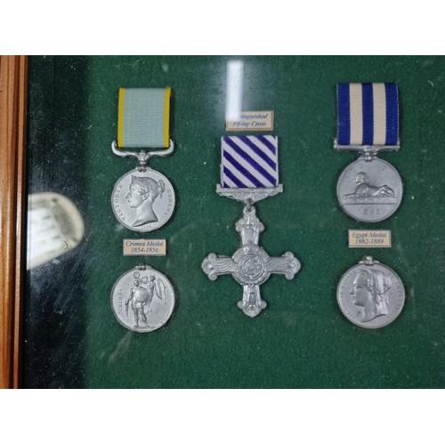 A collection of 3x display boxes displaying an array of replica medals ...