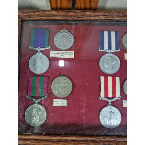 A collection of 3x display boxes displaying an array of replica medals ...