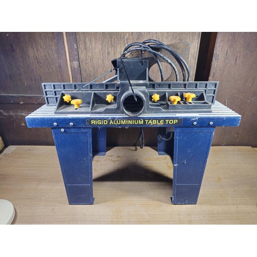 A Mac Allister router table RT200 having a double plug socket and stop ...