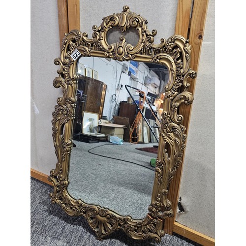 59 - A very good quality vintage gilt framed mirror the gilt frame is carved out of solid wood the frame ... 