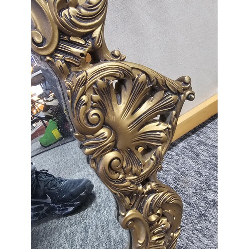 59 - A very good quality vintage gilt framed mirror the gilt frame is carved out of solid wood the frame ... 