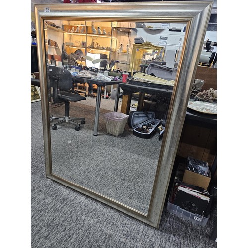 62 - Good quality silver coloured framed bevel edged mirror in good order or large proportions in good or... 