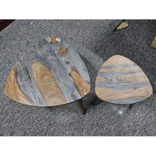 64 - A pair of plectrum shaped wooden topped modern two tone tables both in good order in a grey and brow... 
