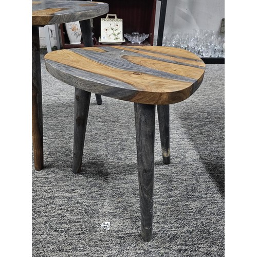 64 - A pair of plectrum shaped wooden topped modern two tone tables both in good order in a grey and brow... 