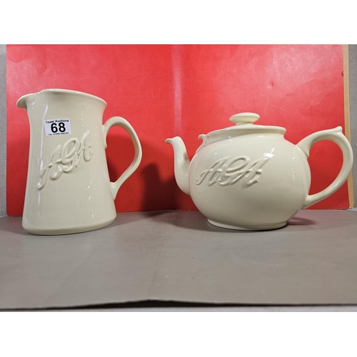 68 - A pair of good quality Aga ceramic kitchen items to include a Aga jug and a 8 person teapot both in ... 