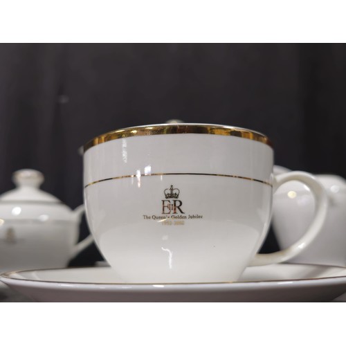 70 - A good quality 4 person tea set in white with gilding to the rim and side, to commemorate Queen Eliz... 