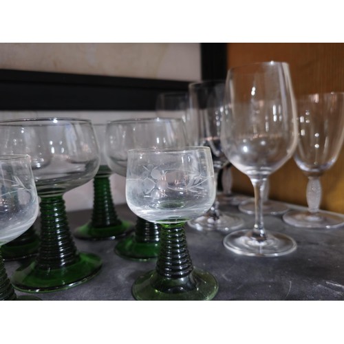 78 - A shelf full of a large collection of drinking glasses to include 9x Villeroy and Boch glasses of va... 