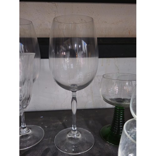 78 - A shelf full of a large collection of drinking glasses to include 9x Villeroy and Boch glasses of va... 