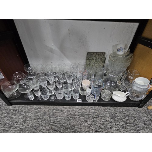 80 - A very large quantity of glass table ware and drinking glasses to include wine glasses, sherry glass... 