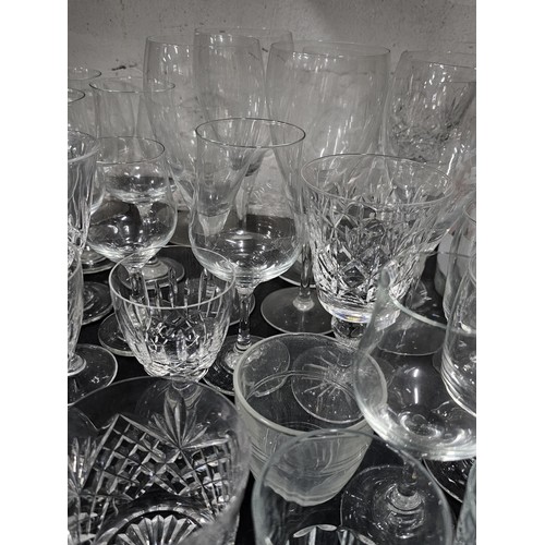 80 - A very large quantity of glass table ware and drinking glasses to include wine glasses, sherry glass... 