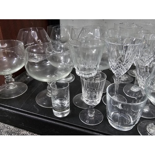 80 - A very large quantity of glass table ware and drinking glasses to include wine glasses, sherry glass... 