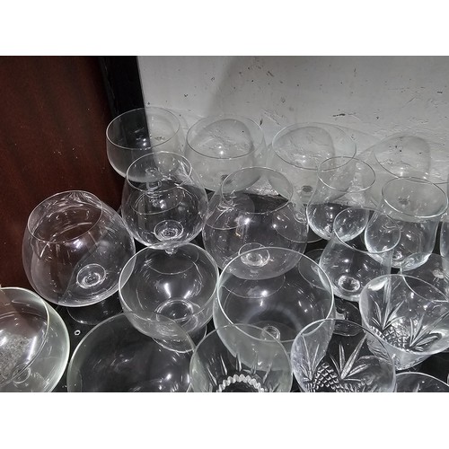 80 - A very large quantity of glass table ware and drinking glasses to include wine glasses, sherry glass... 