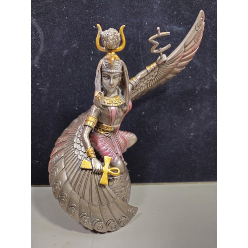 81 - A good quality wooden wall hanging in the form of a Buddha's head along with a resin Egyptian Goddes... 